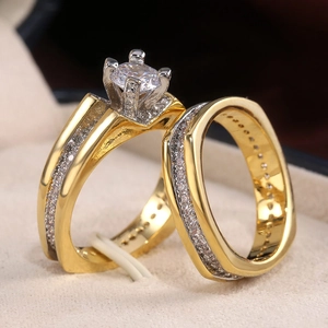 Macro detail of luxury two-tone wedding ring set with AAA cubic zirconia in jewelry box