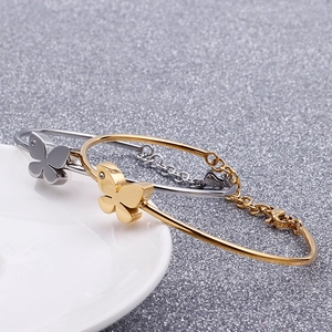 Minimalist butterfly charm bracelet set in gold and silver finish with lobster clasp