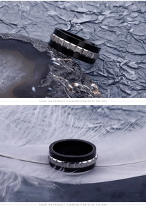 Detailed macro view of black industrial steel ring with silver gear-like texture design