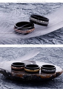 Detail of mechanical gear spinner ring in gold, rose gold and silver matte finishes