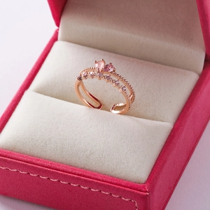 Detail of rose gold adjustable ring featuring twin pink gemstones and micro-pave zircons