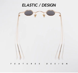 Detail view of steampunk oval sunglasses with flexible elastic metal temples on white background
