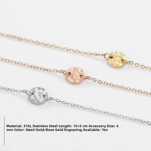Macro detail of 6mm hammered charms on 316L stainless steel chains in three metallic tones