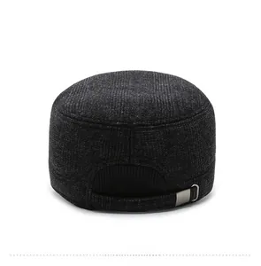 Detail view of the back of a men's winter flat cap with adjustable metal buckle strap