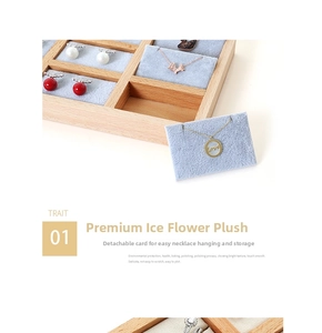Macro detail of wooden jewelry tray with ice flower velvet lining and necklace slots
