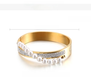 Detailed view of gold stainless steel bangle with pearls and zircon stones plus dimensions