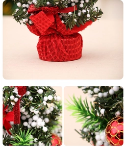 Close-up of artificial pine needles, red checkered ornaments and white berries on Xmas tree