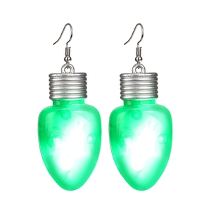 Detailed view of green LED Christmas light bulb earrings with silver hooks on white background