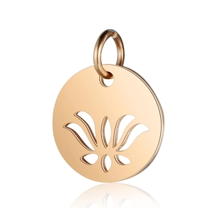 Macro shot of gold-plated stainless steel lotus pendant with hollow floral pattern