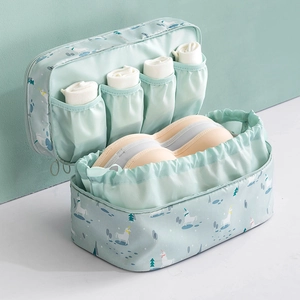 Travel underwear storage bag with mint green unicorn print and multi-compartment design