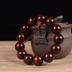 Detail of 18mm Lobular Red Sandalwood beads with high oil gloss and Buddha head knot