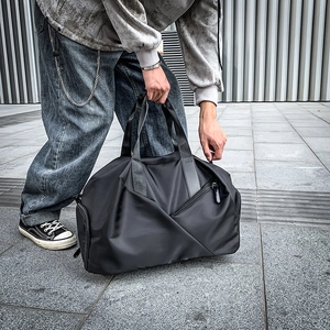 Black large capacity travel duffel bag with detachable shoulder strap for sports and gym
