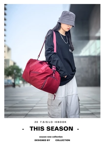 Detail of maroon waterproof travel bag with separate compartment for wet items and shoes