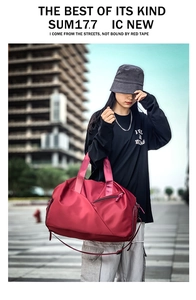 Deep red waterproof fitness bag with reinforced handles and adjustable shoulder strap