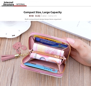 Detail view of pink mini wallet with multi-slot card holder and tassel zipper pull