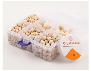 Detail view of natural wood bead DIY kit in transparent grid storage box with elastic cord