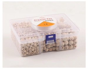 Detailed view of assorted natural wood beads in a plastic storage box with elastic cord
