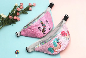 Detail of pink sequin unicorn fanny packs with holographic zippers for little girls