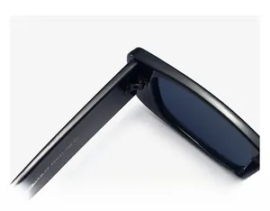Close-up of durable metal hinge and model specs on black square frame sunglasses