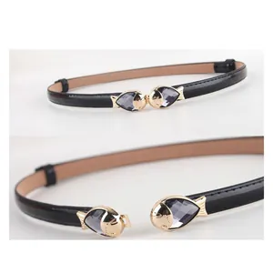 Slim black patent leather belt for women with golden fish buckle and grey crystal