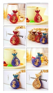 Detail shot of sparkling rhinestone money bag keychains in multiple vibrant colors