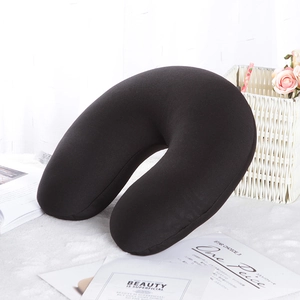 Minimalist black U-shaped travel neck pillow with soft matte finish for office nap and travel
