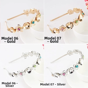 Detail of crystal rhinestone and faux pearl floral headbands in gold and silver finishes
