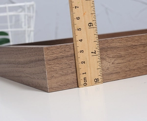Close-up of 4cm thick walnut wood photo frame showing natural grain and size measurement
