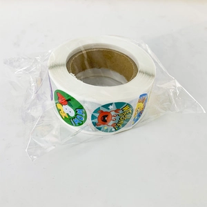Roll of colorful cartoon reward stickers featuring motivational phrases on white background