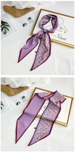 Detail of purple silk scarf with floral and plaid double-sided design on a stylish bag