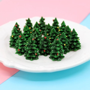 Miniature resin Christmas trees in a white plate for DIY crafts and decorations