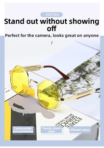 Detail of round steampunk sunglasses with gold metal frame and yellow tinted lenses
