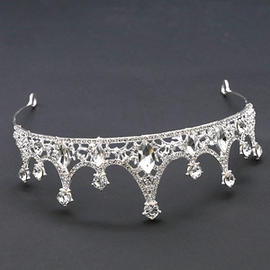 Detailed close-up of a silver crystal tiara with intricate rhinestone embellishments