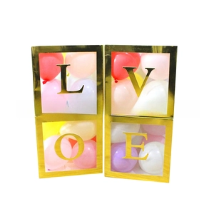 Set of four gold LOVE decorative boxes with transparent windows and colorful balloons