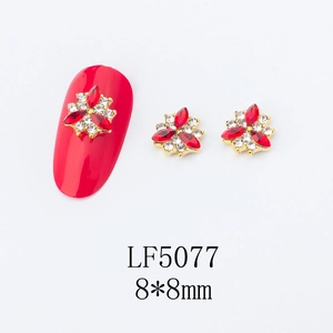 Macro detail of LF5077 3D red crystal flower nail art charms with golden setting 8x8mm