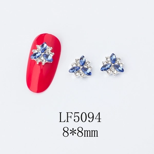 Macro detail of LF5094 8x8mm blue petal nail art charms with crystal rhinestones