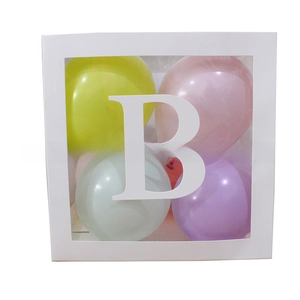Close-up of a white party decorative balloon box with a transparent window and letter B