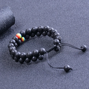 Macro detail of double-layer black lava stone bracelet with rainbow bead accents