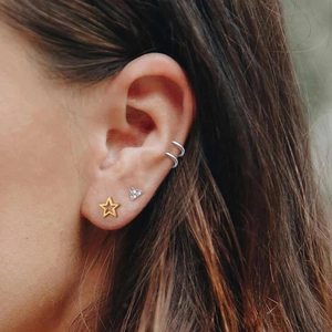 Elegant S925 sterling silver earring set with CZ star and triangle studs on ear