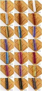 Macro view of elastic sequin headbands in multiple vibrant colors with item codes