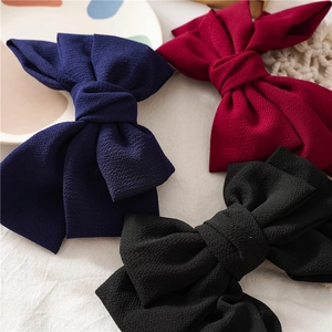 Three-layer crepe fabric bow hair clips in navy blue, burgundy, and black colors