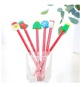 Detail of 6 cartoon Christmas HB pencils with festive erasers in a glass cup