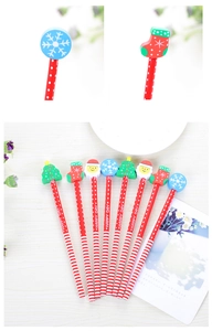 Close-up of Christmas HB pencils with festive erasers like Santa and Christmas trees