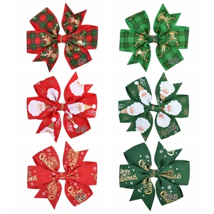 Detailed set of Christmas hair bows with reindeer and Santa patterns on grosgrain ribbon