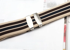 Close-up of adjustable silver metal buckle on striped elastic stretch belt strap