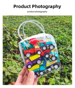 Miniature construction vehicle toy set in a transparent PVC zipper bag on green grass