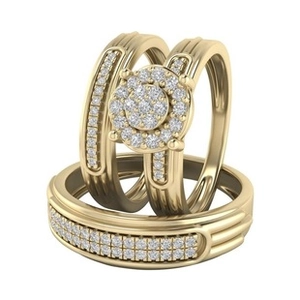 Macro view of gold plated three-piece ring set with stacked cubic zirconia settings