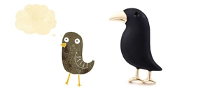 Detailed view of a black enamel crow brooch with golden beak and creative bird illustration