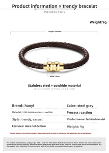 Close-up of 316L stainless steel magnetic clasp on a brown braided leather bracelet