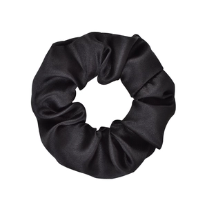 Minimalist black satin scrunchie with smooth silk texture for women's hair styling